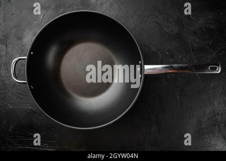 Modern non stick surface frying pan, skillet or sauce pan set with copy space for text or food with copy space for text or food, top view flat lay, on Stock Photo