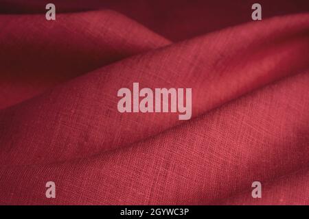 Natural linen fabric texture. Textured red fabric background. Macro with shallow dof Stock Photo