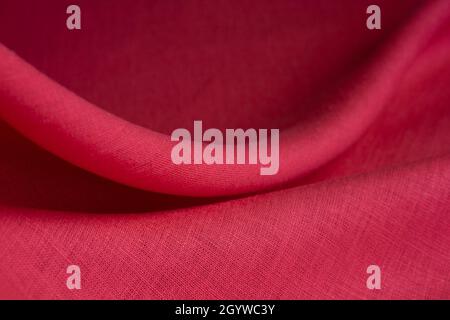 Natural linen fabric texture. Textured red fabric background. Macro with shallow dof Stock Photo