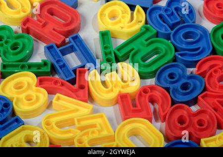 Early Childhood Education, Colorful plastic one to ten number sets in Red, Blue, Green and Yellow colours. in white background. Stock Photo