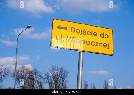 POZNAN, POLAND - Apr 11, 2016: A yellow sign showing redirection to the Wiatracznej street Stock Photo