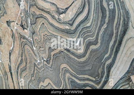 Old, broken, cracked marble. Repaired marble. Stock Photo