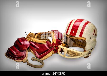 Vintage Boys Football Helmets and Leather Shoulder Pads Stock Photo