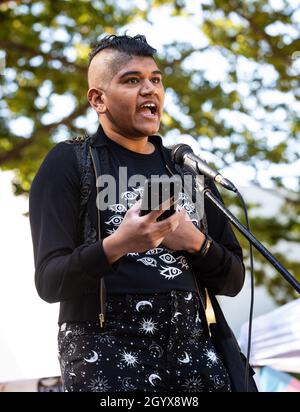 Josie Robo, a spoken word artist, reads their poem 'Land of Imaginary Beasts' as part of National Trans Visibility March Day. Stock Photo