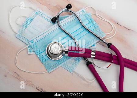 Lay Flat Shot of a Stethoscope and Medical Face Masks Stock Photo