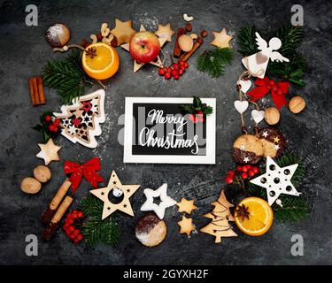 Christmas composition on dark background. Festive background. Top view, flat lay Stock Photo