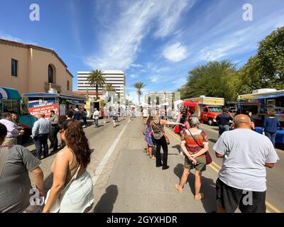 People in line at food trucks at Tucson festival.  Stock Photo