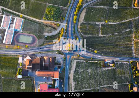 Crossroads with vineyards and sunset lights in Beaujolais Stock Photo