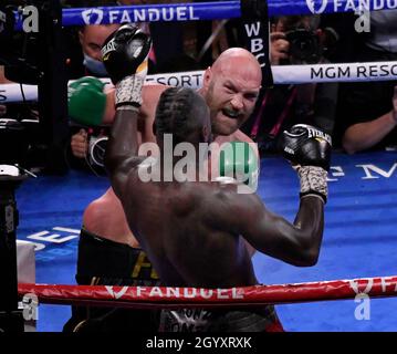 LAS VEGAS, NV - OCTOBER 09: ( In Blk trunks) Tyson Fury delivers a right cross hit during the 11 round and KO's  Deontay Wilder for the World Heavyweight Championship III trilogy fight at T-Mobile Arena Saturday October 9, 2021 in Las Vegas, Nevada.(MB Media) Stock Photo