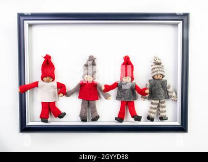 Funny christmas dwarfs in image frame on white background Stock Photo