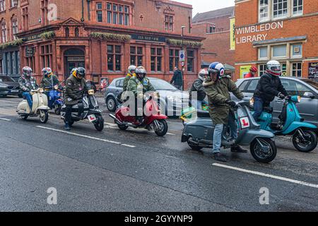 WIMBLEDON LONDON, UK. 10 Oct, 2021. A group of Mods scooter riders on Vespas seen in Wimbledon town centre. Credit: amer ghazzal/Alamy Live News Stock Photo