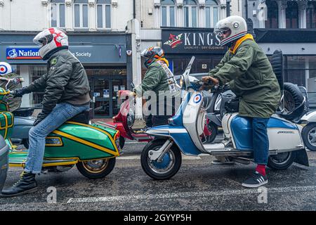 WIMBLEDON LONDON, UK. 10 Oct, 2021. A group of Mods scooter riders on Vespas seen in Wimbledon town centre. Credit: amer ghazzal/Alamy Live News Stock Photo