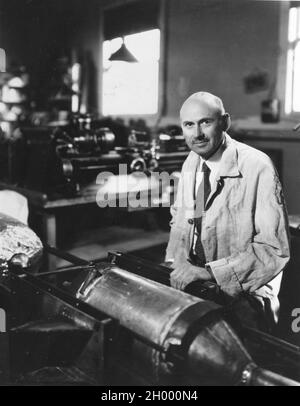 Dr. Robert Goddard works on a rocket at his shop in Roswell, New Mexico. Dr. Goddard is recognized as the 'Father of American Rocketry.' October 1935. Stock Photo