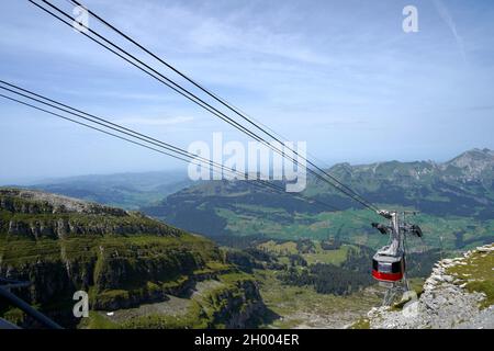 Cable car going to mountain Chaeserrugg in region Toggenburg, Switzerland. Photo taken in summer. Aerial view with copy space on the background. Stock Photo