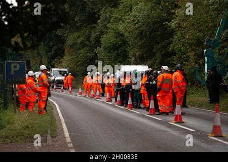 Aylesbury Vale, UK. 10th October, 2021. National Eviction Team bailiffs working for HS2 assisted by HS2 Security and Thames Valley Police were trying to evict anti HS2 protesters holed up in big woodland fortresses at the WAR Against HS2 camp this morning. The land off the A413 just outside Wendover is owned by Buckinghamshire Council but has been seized by court order by HS2 Ltd. The High Speed Rail 2 rail construction is having a devastating impact upon woodland and wildlife sites in Wendover. Credit: Maureen McLean/Alamy Live News Stock Photo