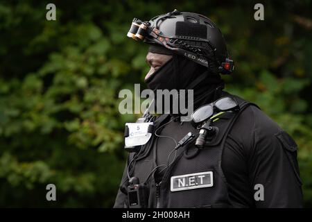 Aylesbury Vale, UK. 10th October, 2021. National Eviction Team bailiffs working for HS2 assisted by HS2 Security and Thames Valley Police were trying to evict anti HS2 protesters holed up in big woodland fortresses at the WAR Against HS2 camp this morning. The land off the A413 just outside Wendover is owned by Buckinghamshire Council but has been seized by court order by HS2 Ltd. The High Speed Rail 2 rail construction is having a devastating impact upon woodland and wildlife sites in Wendover. Credit: Maureen McLean/Alamy Live News Stock Photo