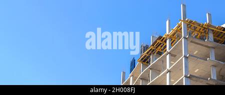 Banner residential construction site against blue sky background with copy space. Construction industry concept photo Stock Photo
