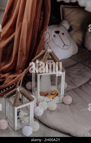 Christmas. A flashlight candlestick, vintage decorative, in a white interior Stock Photo
