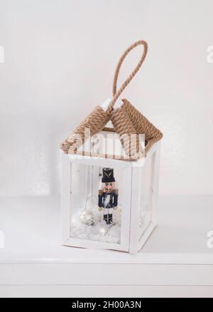 Christmas. A flashlight candlestick, vintage decorative, in a white interior Stock Photo