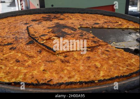 Socca, a chickpea pancake, is a favourite snack in Nice, France Stock Photo