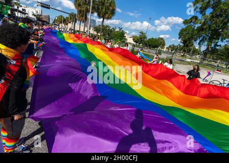 High school students carry a giant rainbow flag during the Come Out With Pride Festival and Parade in downtown Orlando Florida on October 9, 2021. Tens of thousands of members of the LGBTQ community and their allies gathered for the annual event in Lake Eola Park. (Photo by Ronen Tivony/Sipa USA) *** Please Use Credit from Credit Field *** Stock Photo