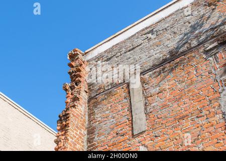 Exposed Bricks on Crumbling Wall in Downtown New Orleans Stock Photo