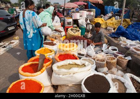 A vendor in the spice market in Chandni Chowk the old city of Delhi Stock Photo