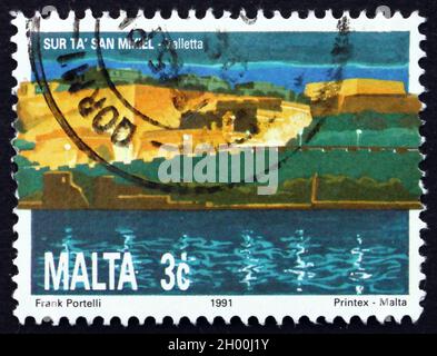 MALTA - CIRCA 1991: a stamp printed in Malta shows St. Michael’s Bastion, Valletta, circa 1991 Stock Photo