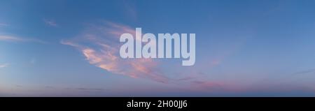 Panorama of blurred clouds in the blue sky in the evening. Stock Photo