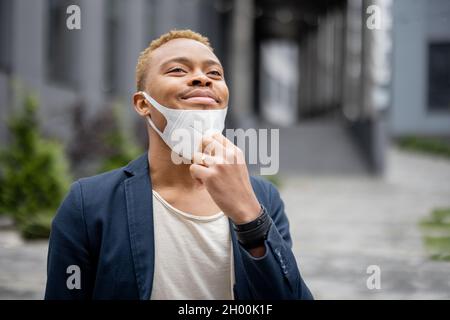 Man taking off medical mask and enjoy fresh air Stock Photo