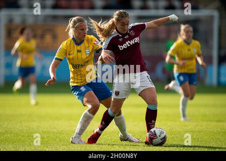 Birmingham City's Rebecca Holloway and West Ham United's Claudia Walker (right) battle for the ball during the FA Women's Super League match at Chigwell Construction Stadium, London. Picture date: Sunday October 10, 2021. Stock Photo