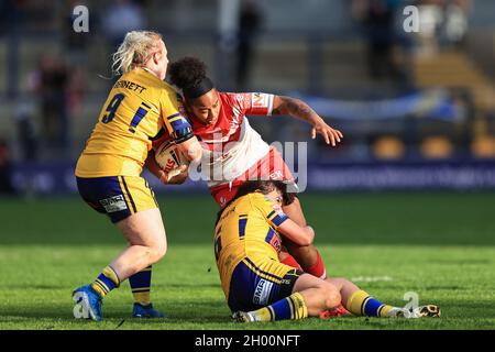 Leeds, UK. 10th Oct, 2021. Chantelle Crowl #13 of St Helens is tackled by Keara Bennett #9 of Leeds Rhinos and Hanna Butcher #6 of Leeds Rhinos in Leeds, United Kingdom on 10/10/2021. (Photo by Mark Cosgrove/News Images/Sipa USA) Credit: Sipa USA/Alamy Live News Stock Photo