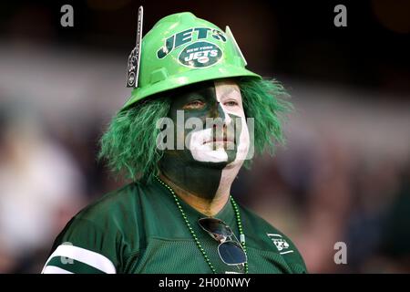 A New York Jets fan stands with a paper bag on his head in the 2nd