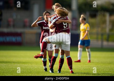 West Ham United's Claudia Walker celebrates scoring her sides first goal with team-mate Dagny Brynjarsdottir during the FA Women's Super League match at Chigwell Construction Stadium, London. Picture date: Sunday October 10, 2021. Stock Photo