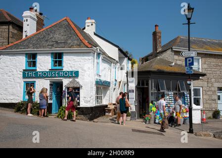 Mousehole, Cornwall, England UK. 2021. Holidaymakers shopping in the Cornish coastal town of Mousehole a scenic holiday resort on the  south Cornwall Stock Photo