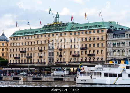 Stockholm, Sweden - August 9, 2019: Grand Hotel. Exterior view from the sea. It is located next to the Nationalmuseum and opposite the Royal Palace an Stock Photo