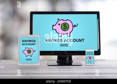 Savings account concept shown on different information technology devices Stock Photo