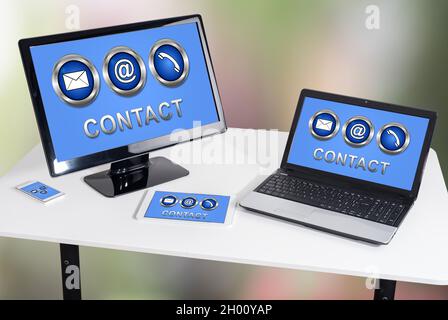 Contact concept shown on different information technology devices Stock Photo