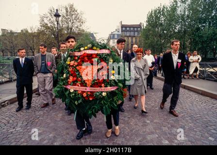 Paris, France, Crowd Marching with Wreath, Memorial Ceremony Homosexuel Deportation, during World War 2, WWII AND pink triangle gay commemorating paris April, 1995 Stock Photo