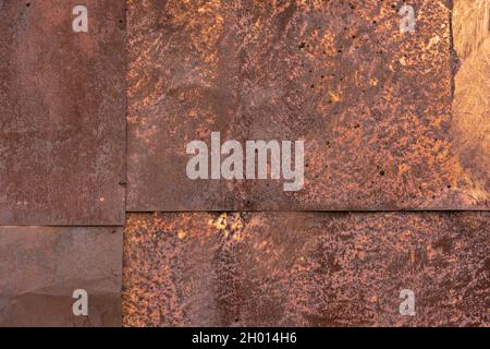 Rusted tin sheets patchwork wall texture and flat full frame background. Stock Photo
