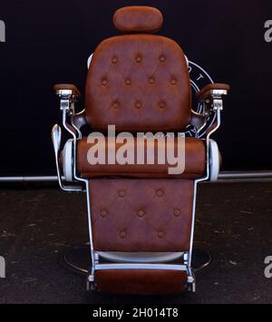Barber shop chair on black background Stock Photo