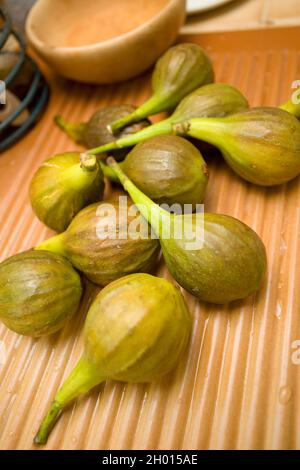 Washed figs on kitchen draining board. uk Stock Photo