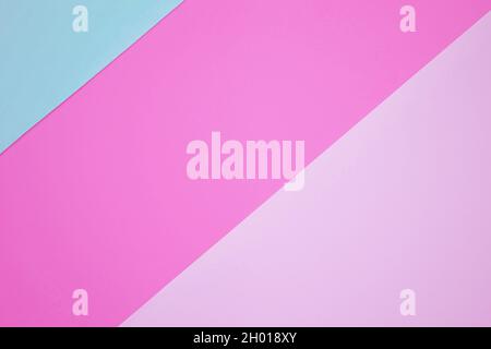Abstract background from pink and blue color paper. Paper background with diagonal lines. Sheets of paper of different colors. Stock Photo