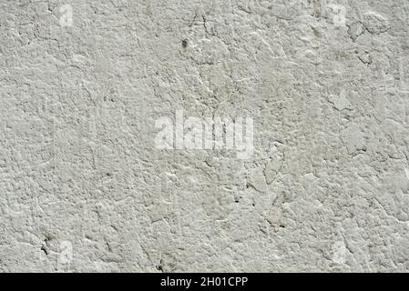 Wall painted many times in white with many cracks and chips. Vector painted cement texture Stock Photo
