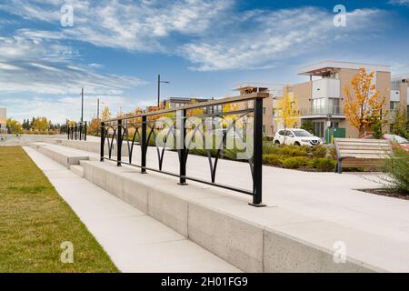 Calgary Alberta Canada, October 1 2021: Community park with artistic metal railings at the new University District in a Canadian city. Stock Photo