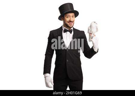 Magician holding a white dove on his hand isolated on white background Stock Photo