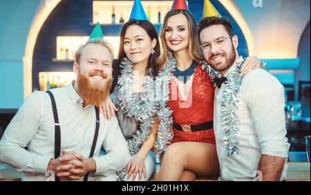 Happy young couple posing at party Stock Photo