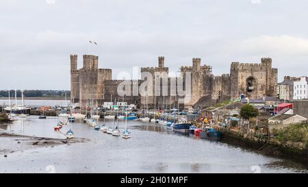 Caernarfon waterfront and castle which make up the Unesco Heritage site seen on the North Wales coast in October 2021. Stock Photo
