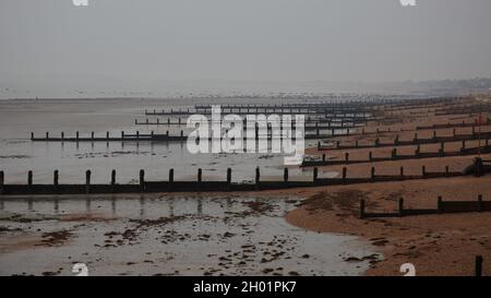 Atmospheric early morning view over the sea defences of Bognor Regis in autumn. Stock Photo