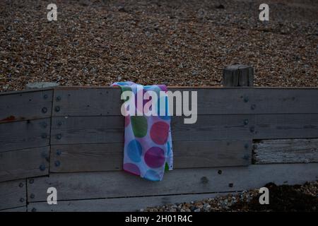 Piece of textile on the beach. Stock Photo